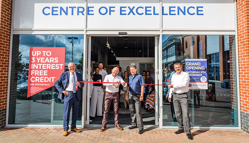 Dominic Littlewood cuts the ribbon at new showroom
